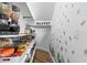 Organized pantry with shelving, storage baskets, and labeled containers for easy access and organization at 8010 Soldierwood St, Winter Garden, FL 34787
