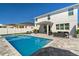 Backyard pool area with lounge chairs and seating provides the perfect outdoor relaxation and entertainment space at 8010 Soldierwood St, Winter Garden, FL 34787