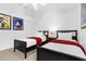 bedroom with two twin beds and colorful Mickey Mouse themed art at 8073 Santee Dr, Kissimmee, FL 34747