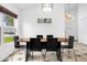 Bright dining room with a modern chandelier and a view of the yard at 8073 Santee Dr, Kissimmee, FL 34747