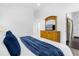 Spacious main bedroom features a large dresser with a TV and wood-look flooring at 8073 Santee Dr, Kissimmee, FL 34747