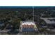 An aerial view of the construction site surrounded by lush trees and neighboring buildings at 1002 E Robinson St # 1, Orlando, FL 32801