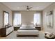 Serene main bedroom featuring neutral tones, minimalist decor, and soft, sheer curtains at 1002 E Robinson St # 1, Orlando, FL 32801