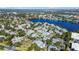 Picturesque aerial view showcasing the community's layout, surrounding trees, and serene lake at 1033 S Hiawassee Rd # 2628, Orlando, FL 32835