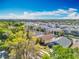 Aerial view of residential neighborhood, showcasing tree coverage and home styles at 1049 Winding Water Way, Clermont, FL 34714