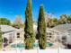 Aerial view of the backyard featuring a screened pool area and lush landscaping for outdoor enjoyment at 1049 Winding Water Way, Clermont, FL 34714