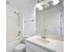 Bright bathroom featuring neutral walls, a single sink, a shower and tub combination at 1049 Winding Water Way, Clermont, FL 34714