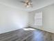 Bedroom featuring neutral walls, laminate flooring, a ceiling fan and natural light at 1049 Winding Water Way, Clermont, FL 34714