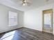 Bedroom featuring neutral walls, laminate flooring, a ceiling fan and natural light at 1049 Winding Water Way, Clermont, FL 34714