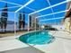 Screened-in pool area featuring a blue pool, screened enclosure, and a sunny sky at 1049 Winding Water Way, Clermont, FL 34714