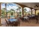 Inviting outdoor dining area overlooking the pool, perfect for enjoying meals in a resort setting at 122 Capri Dr, Davenport, FL 33897