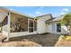 Exterior view of a home with a screened patio and partially xeriscaped backyard at 12235 Warren Rd, Clermont, FL 34711