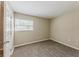 This cozy bedroom offers neutral colors, comfortable carpet, and a bright window at 1306 Shepherd Ave, Sanford, FL 32771