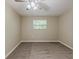 A comfortable bedroom with plush carpet, neutral paint, and ample natural light at 1306 Shepherd Ave, Sanford, FL 32771