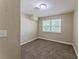 Bedroom features a neutral color palette and a window with bright natural light at 1306 Shepherd Ave, Sanford, FL 32771