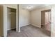 A secondary bedroom featuring neutral walls, plush carpet, and closet for storage at 1306 Shepherd Ave, Sanford, FL 32771