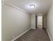 Bedroom featuring neutral carpeting and an entry to an additional room at 1306 Shepherd Ave, Sanford, FL 32771