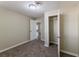 Bedroom featuring neutral carpeting and an open closet for storage at 1306 Shepherd Ave, Sanford, FL 32771