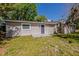 Exterior shot showcasing the backyard and the side entrance of the home at 1306 Shepherd Ave, Sanford, FL 32771