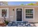 Close-up view of the home's front door, windows and exterior lighting at 1306 Shepherd Ave, Sanford, FL 32771