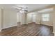 Bright living room featuring luxury vinyl plank flooring and a ceiling fan at 1306 Shepherd Ave, Sanford, FL 32771