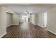 Spacious living room featuring luxury vinyl plank flooring and access to other rooms at 1306 Shepherd Ave, Sanford, FL 32771