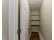 Storage area with wood-look flooring and white shelves at 1306 Shepherd Ave, Sanford, FL 32771