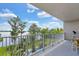 Balcony with views of the lake, pool, and landscaped gardens at 13427 Blue Heron Beach Dr # 103, Orlando, FL 32821