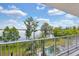 Balcony with views of the lake, pool, and landscaped gardens at 13427 Blue Heron Beach Dr # 103, Orlando, FL 32821