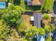 Aerial view of the property showcasing lush greenery and the layout of the home at 145 W Fern Dr, Orange City, FL 32763