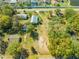 Expansive aerial view of a property featuring mature trees and several buildings at 15765 Sunflower Trl, Orlando, FL 32828