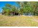 View of backyard showing sheds and chicken coop at 15765 Sunflower Trl, Orlando, FL 32828