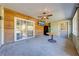 Enclosed sun room featuring a ceiling fan and natural wood accents at 15765 Sunflower Trl, Orlando, FL 32828