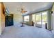 Bright sun room featuring wood walls, tile flooring, and ample natural light at 15765 Sunflower Trl, Orlando, FL 32828