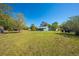 Well-maintained front yard showcasing lush green grass and a charming home at 15765 Sunflower Trl, Orlando, FL 32828