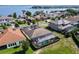 Aerial shot of the house, highlighting its screened-in pool area with a lake view at 16736 Broadwater Ave, Winter Garden, FL 34787