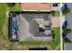 An aerial view of the house, featuring a swimming pool, jacuzzi, and outdoor seating area at 16736 Broadwater Ave, Winter Garden, FL 34787