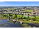 Stunning aerial view of lakefront homes with private docks and community green spaces, offering luxurious lakeside living at 16736 Broadwater Ave, Winter Garden, FL 34787