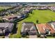 Panoramic aerial view of the residential community, highlighting the green space and lake views at 16736 Broadwater Ave, Winter Garden, FL 34787