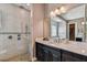 This bathroom boasts a double sink vanity, walk-in shower, and soaking tub in neutral color palette at 16736 Broadwater Ave, Winter Garden, FL 34787