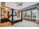 Spacious bedroom with tray ceiling, decorative columns, and abundant natural light at 16736 Broadwater Ave, Winter Garden, FL 34787