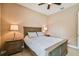 Cozy bedroom featuring neutral tones, a ceiling fan, and matching nightstands at 16736 Broadwater Ave, Winter Garden, FL 34787