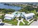 Scenic aerial view of the community pool and gym surrounded by greenery and parking at 16736 Broadwater Ave, Winter Garden, FL 34787