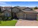 Stunning home featuring stone accents, a three-car garage, and a beautifully paved driveway at 16736 Broadwater Ave, Winter Garden, FL 34787