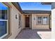 Inviting front entrance with a wood door, paver patio, and elegant exterior lighting at 16736 Broadwater Ave, Winter Garden, FL 34787