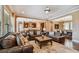 Elegant living room open to kitchen with hardwood floors, and stylish furniture at 16736 Broadwater Ave, Winter Garden, FL 34787