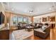 Spacious living room featuring hardwood floors, neutral paint, recessed lighting, and a comfortable seating arrangement at 16736 Broadwater Ave, Winter Garden, FL 34787