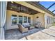 Covered patio with comfortable seating, ceiling fans, and an inviting outdoor space at 16736 Broadwater Ave, Winter Garden, FL 34787