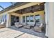 Covered patio with comfortable seating, ceiling fans, and an outdoor living space with a brick floor at 16736 Broadwater Ave, Winter Garden, FL 34787