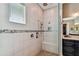 The walk-in shower features a bench, rain shower head, and handheld shower at 16736 Broadwater Ave, Winter Garden, FL 34787